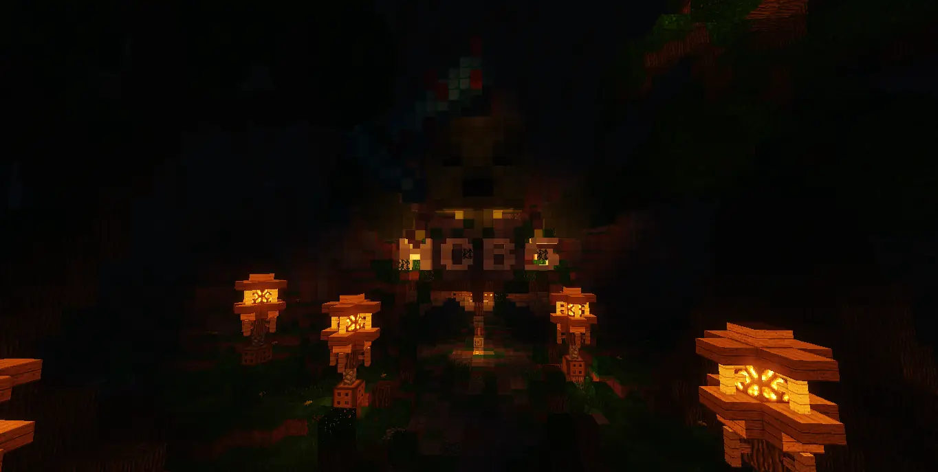 Entrada da /warp mobs à noite, com o letreiro MOBS iluminado